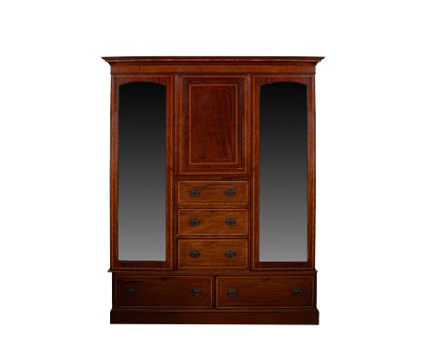 An Edwardian mahogany and satinwood banded wardrobe, fitted with an arrangement of cupboards and drawers, the sides each with