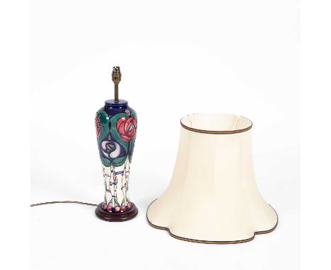 A Moorcroft lamp, 'Tribute to Charles Rennie Mackintosh', tube lined, mounted on a circular wooden base, 51cm high (not inclu