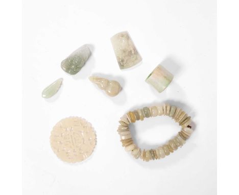 Assorted nephrite and jadeite pieces, to include an archers ring, 2.5cm, a pierced amulet, beaded bracelet, pendants etc (7)