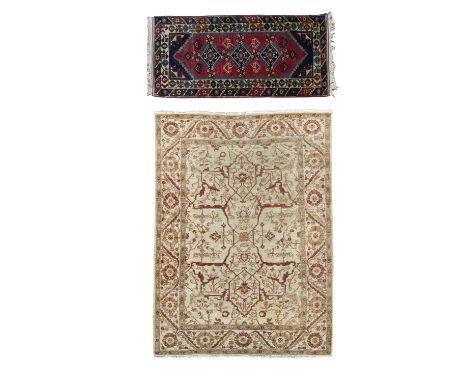 A Ziegler design rug possibly Pakistan, late 20th Century, the ivory field with an all over Garrus design, framed by a rosett