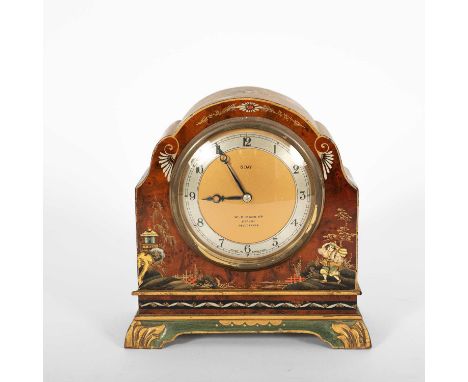 An early 20th Century mahogany mantel clock, decorated in the chinoiserie style, the circular dial with silvered chapter ring