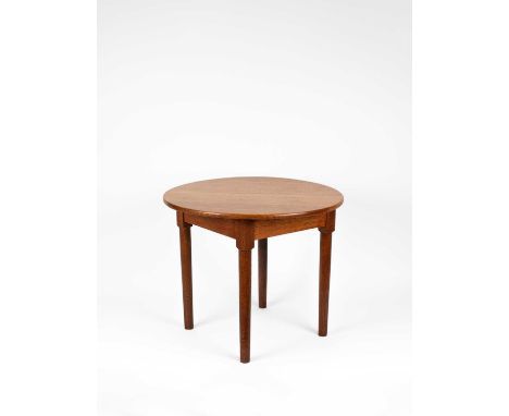 A Heal's circular oak table on plain legs, with Heal & Son Ltd. label and stamped 214 61, 67.5cm diameter, 57cm high      All