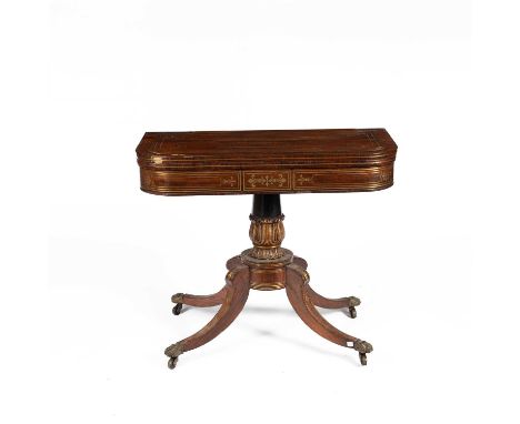 A Regency rosewood and brass inlaid card table, the fold over top enclosing baize lined interior on a turned column and four 