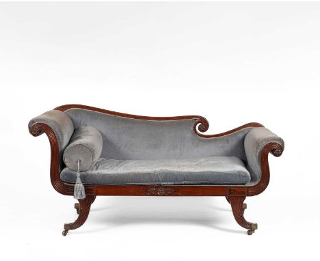 A Regency mahogany framed double scroll end sofa, on reeded sabre legs, 179cm wide, 64cm deep, 90cm high