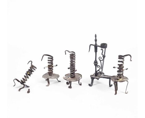Five wrought iron candlesticks to include a wrought iron combination Splint candlestick, likely 18th century, with a footed d
