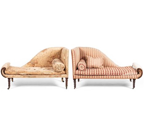 A pair of late Regency upholstered sofas with scroll ends, raised on turned legs, each with a loose and bolster cushion, the 
