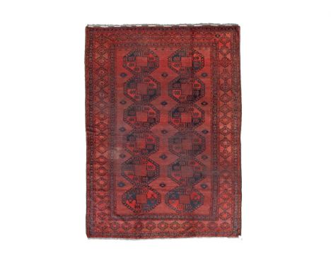 An Ersari main carpet North Afghanistan, circa 1890, the madder field of two columns of large octagonal guls, framed by geome