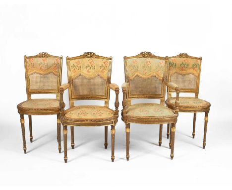 A Louis XVI style gilt framed salon suite, comprising two armchairs and two single chairs, with needlework back panels and se