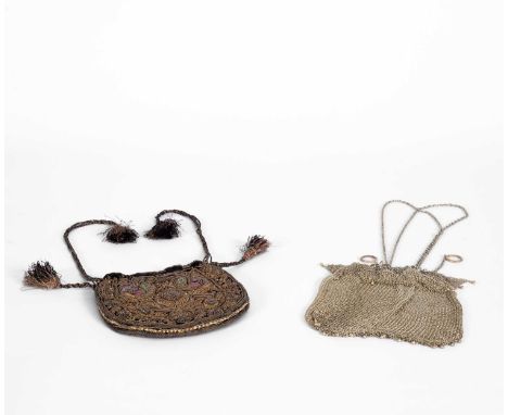 Two early 20th Century handbags or purses to include a small velvet drawstring bag with profuse metal thread embroidery, line