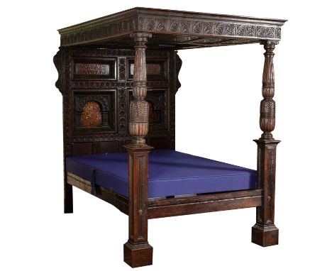 An oak four poster tester bed, 17th Century and later, the canopy with moulded cornice and lunette carved frieze, the headboa