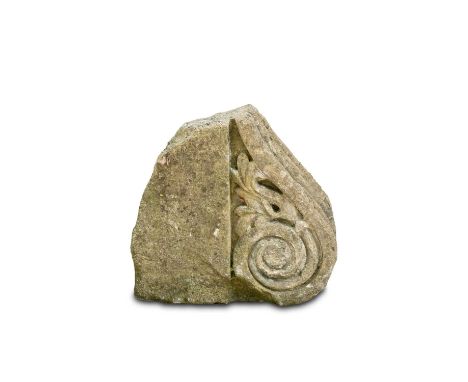 A dressed stone scroll, the architectural fragment 33cm, 35cm, 15cm