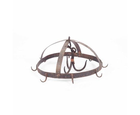 An iron game hanging spit, with three central hooks and an outer ring hung with eight hooks, 50cm diameter