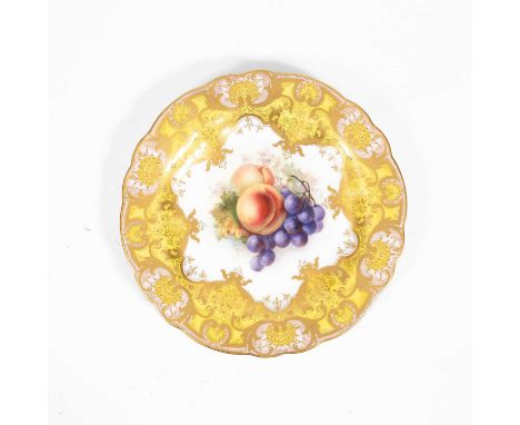 A Royal Worcester plate, painted to the centre with a still life study of peaches and grapes, signed R. Sebright, within yell