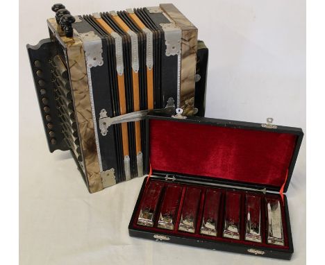 Cased set of Swan blues harmonicas &amp; a Comander accordion