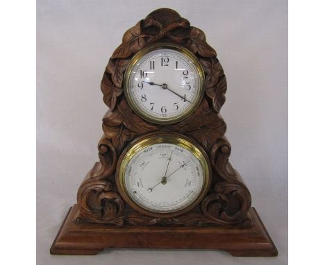 19th century walnut barometer and clock set carved with leaves and scrolls on a stepped plinth H 33.5 cm