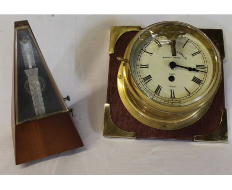 Metronome and a Sestrel brass cased bulk head clock