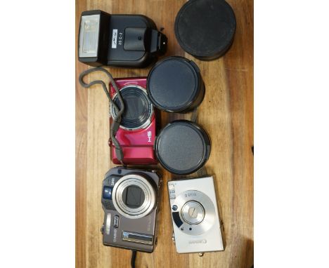 2 Casio digital cameras, Cannon camera, Hoya 58 mm lens x2, 20 c-2 flash & high definition lens - all with cases(not photogra