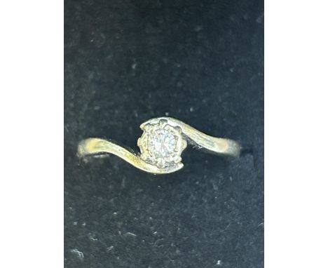 9ct White gold ring set with 0.10 solitaire diamond. Size N Total weight 2.6g 