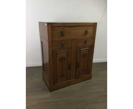 EARLY 20TH CENTURY OAK CABINET,with full width drawer over two small drawers with two carved doors, 117cm high, 94cm wide, 50