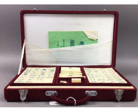 MAHJONG SET AND SET OF FOUR TILE RACKS,the tiles of bone and bamboo, both cased/boxed