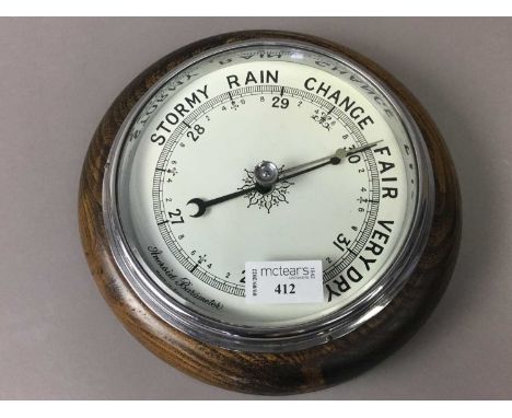 ANEROID BAROMETER,along with a group of items including a brass desk weight, oil lamp, candlestick and bookends 