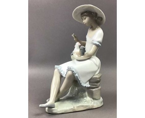 TWO NAO FIGURES,the larger modelled as a girl holding a cockerel, 24.4cm high, together with a Lladro figure, a jug, a stein,