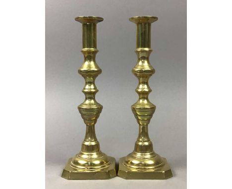PAIR OF BRASS CANDLESTICKS,24.5cm high, along with a brass picture easel, butter dish and figure of a horse