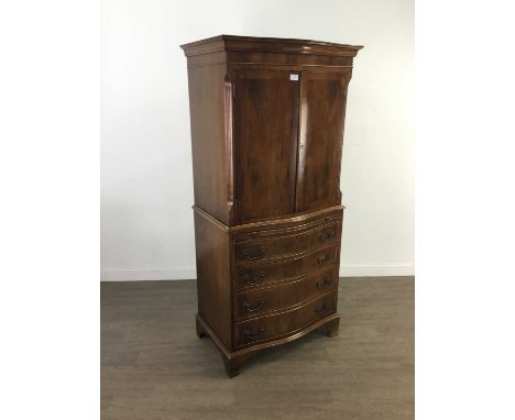 MAHOGANY REPRODUCTION SERPENTINE CABINET ON CHEST,with two doors over four graduated drawers on bracket feet, 154cm high, 70c