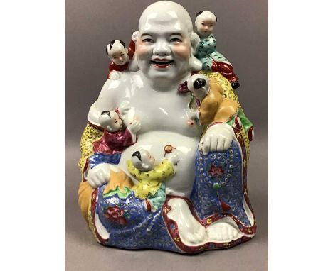 20TH CENTURY CHINESE POLYCHROME BUDDHA,mounted with climbing boys, 25cm high, along with a Chinese figure of a scholar, a gre