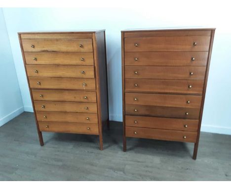 PAIR OF MID CENTURY TEAK CHESTS OF DRAWERS,each with eight drawers and brass pull handles, 129cm high, 76cm wide, 46cm deepTo