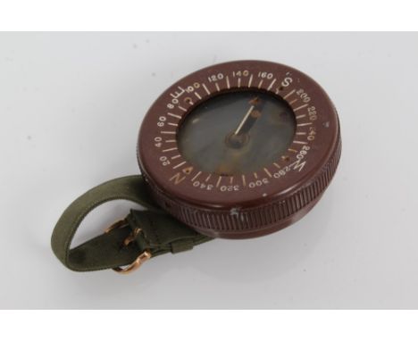 Second World War American paratroopers' brown bakelite arm band compass, by Taylor, on canvas strap