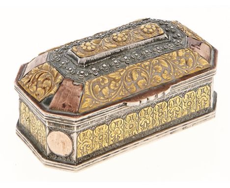 An Indian silver and gold coloured metal mounted repousse betel box, late 19th c, cut cornered with domed lid and central div