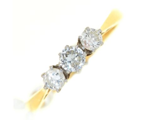 A three stone diamond ring, gold hoop marked PLAT 18ct, 2.2g, size H Condition ReportGood condition