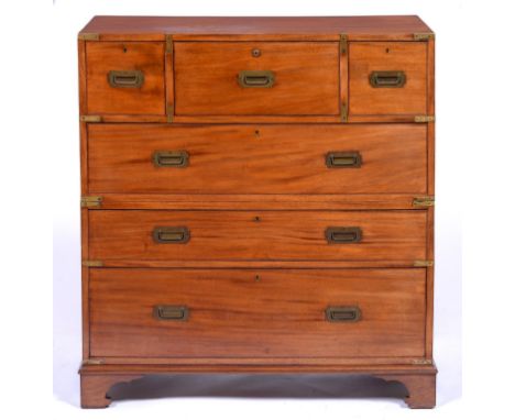 A Victorian brass mounted mahogany military chest of drawers, in two sections, the secretaire to the upper part with Brahma l