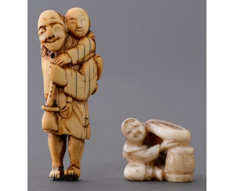 A Japanese ivory netsuke of a musician, late 19th / early 20th c, carrying a boy lion his back and a smaller netsuke of a boy