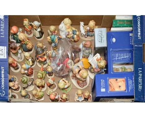 A collection of Goebel pottery figures of children, designed by M J Hummel, various sizes, printed mark, several boxed Condit