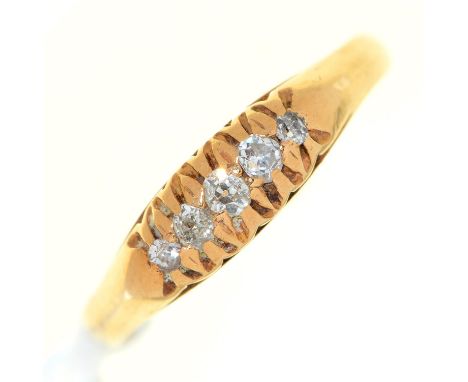 A five stone diamond ring, with old cut diamonds, in gold marked 18ct, 3.5g, size P Condition ReportLight wear