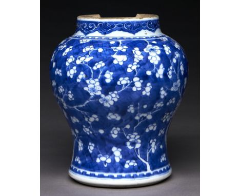 A Chinese blue and white jar, Kangxi period, painted with prunus on a cracked ice ground, 24cm h Condition ReportNeck damaged