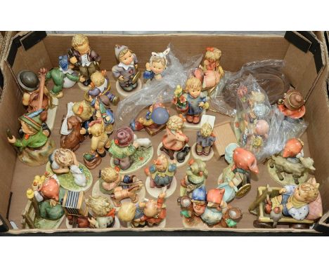 A collection of Goebel pottery figures and groups of children, designed by M J Hummel, various sizes, printed mark Condition 