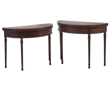 A pair of mahogany half round tea tables, c1900, with bead moulding, on partly fluted tapering turned legs and bulb feet, 72.