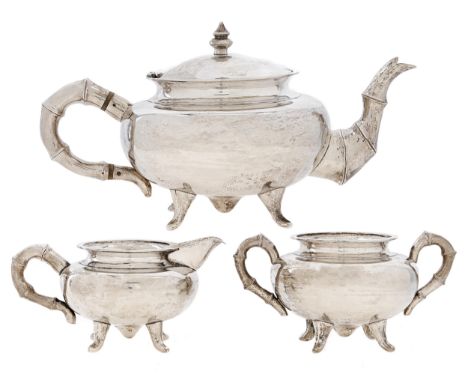 A Chinese three-piece silver tea service, early 20th c,&nbsp;with bamboo form handles and spout, teapot 12.5cm h, marked WH a