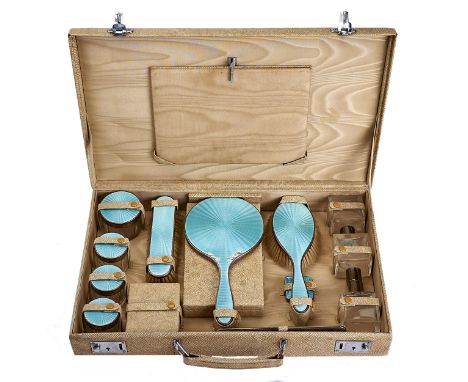 A George V silver and turquoise guilloche enamel fitted cream leatherette dressing case-within-case, 50cm l, fittings by W Co