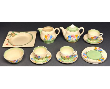 Clarice Cliff.&nbsp; An A J Wilkinson Crocus pattern teacup, saucer and side plate, c1950, plate 16cm diam, gilt printed Roya