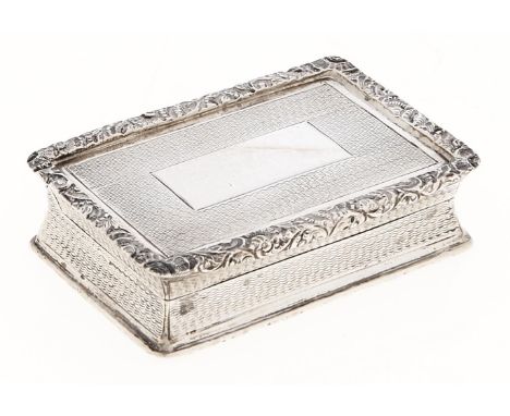 An Edwardian silver snuff box, with waisted sides and engine turned, foliate chased borders, 73mm l, by Thomas Hayes, Birming