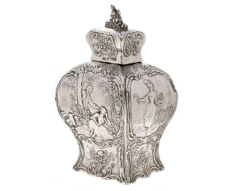 A Dutch silver tea caddy and cover, the sides cast with lovers and a gleaner, flowers and scrolls, 14.5cm h, spurious 18th c 