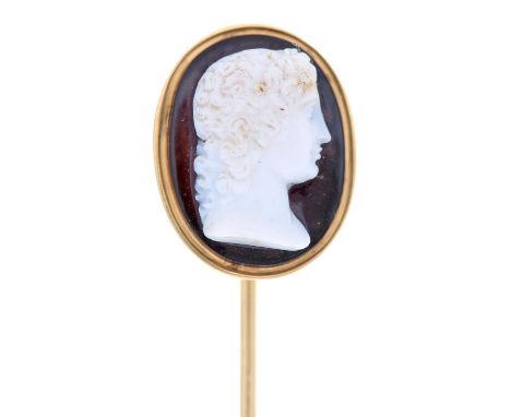 A hardstone cameo, 19th c,&nbsp;of onyx, carved with the head of Venus, mounted in a gold stick pin, head 15 x 20mm, 6.1g 