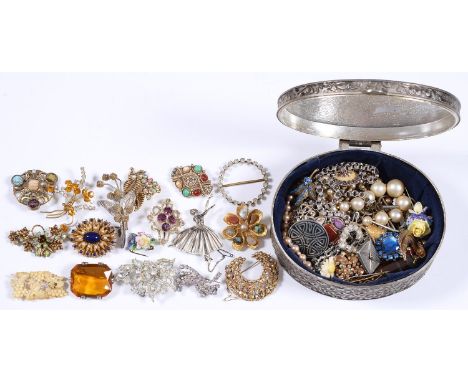 Miscellaneous vintage costume jewellery, late 19th c and later, in a plated oval jewel box 