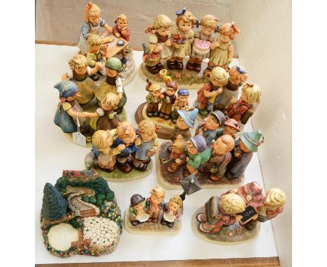 A collection of Goebel groups of children, designed by M J Hummel, various sizes, printed mark and a related resin model Cond