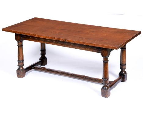 A oak refectory table, late 20th c,&nbsp;in early 17th c English style, the substantial four plank top above channelled rails