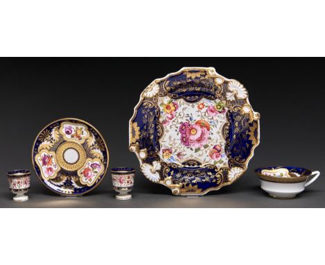 A bone china dessert plate or stand, probably Coalport, c1825, painted with five groups of flowers reserved on a richly gilt 